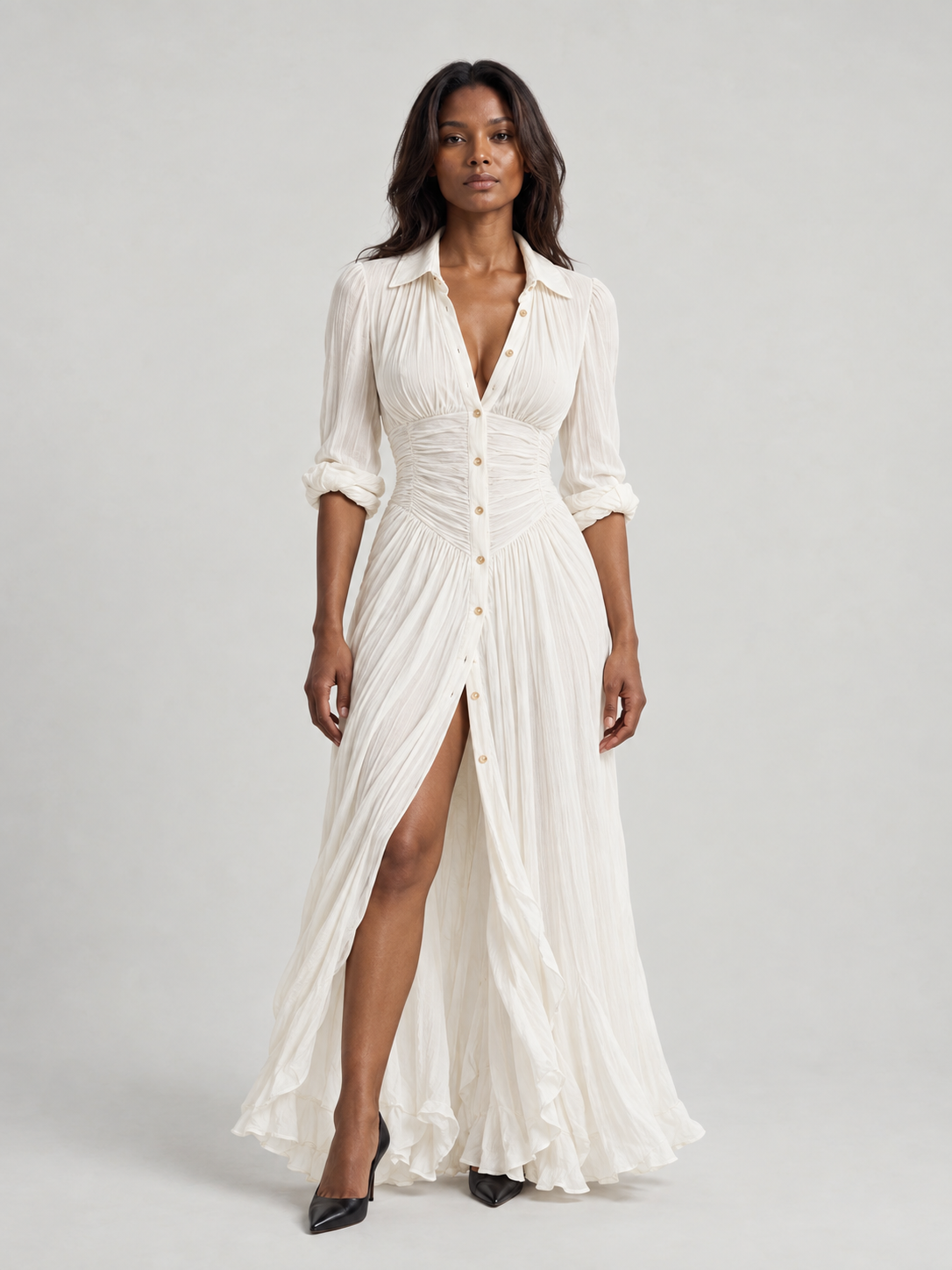 Robe longue ceinturée à revers plissés